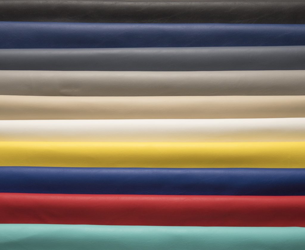 Stacked rolls of 1mm vinyl in a range of colours at Kehls