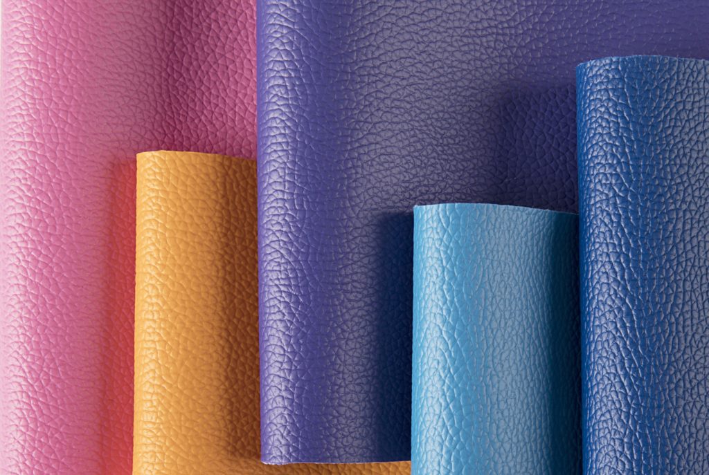 Rolls of leather-grain upholstery vinyl in bright colours at Kehls